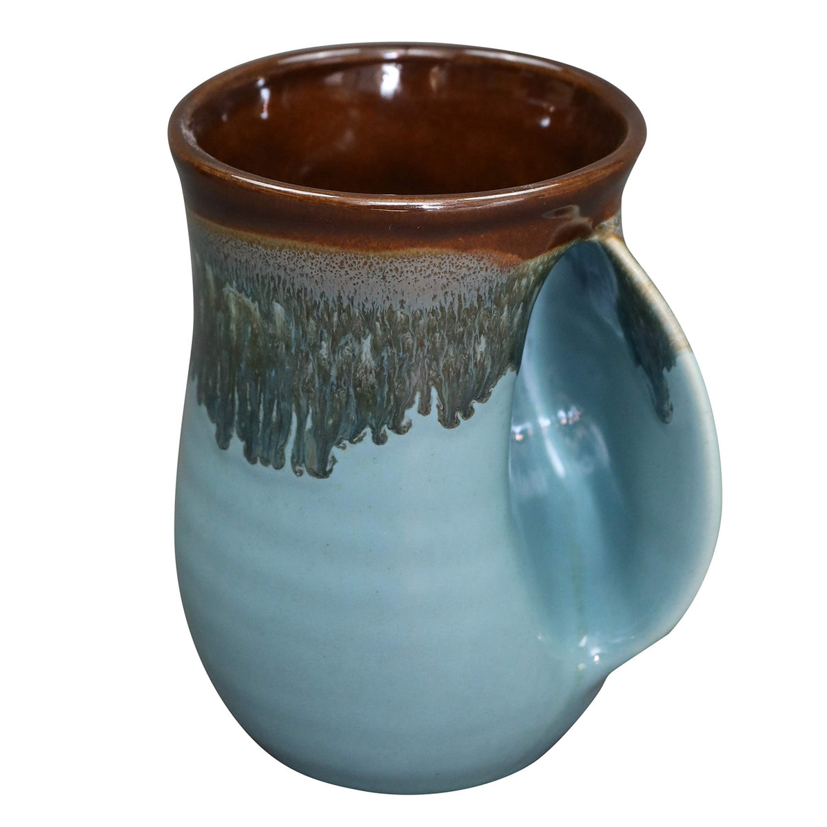 Clay in Motion: taza con calentador para la mano derecha que mantiene las manos cálidas.