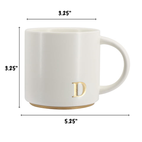 COLLECTIVE HOME cerámica con alfabeto dorado, diseño elegante para tu café diario.