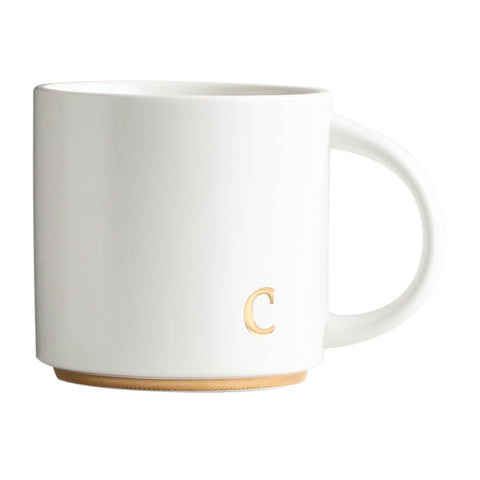 COLLECTIVE HOME, taza cerámica con monograma dorado, ideal para café matutino