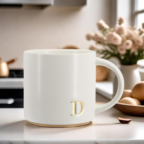 COLLECTIVE HOME taza con monograma dorado, regalo perfecto en caja premium.