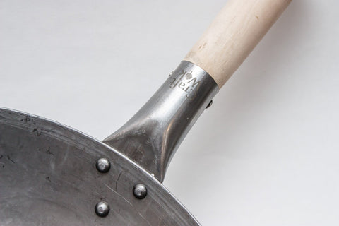 Craft Wok diseñado por artesanos chinos para cocinas profesionales en Guangzhou.
