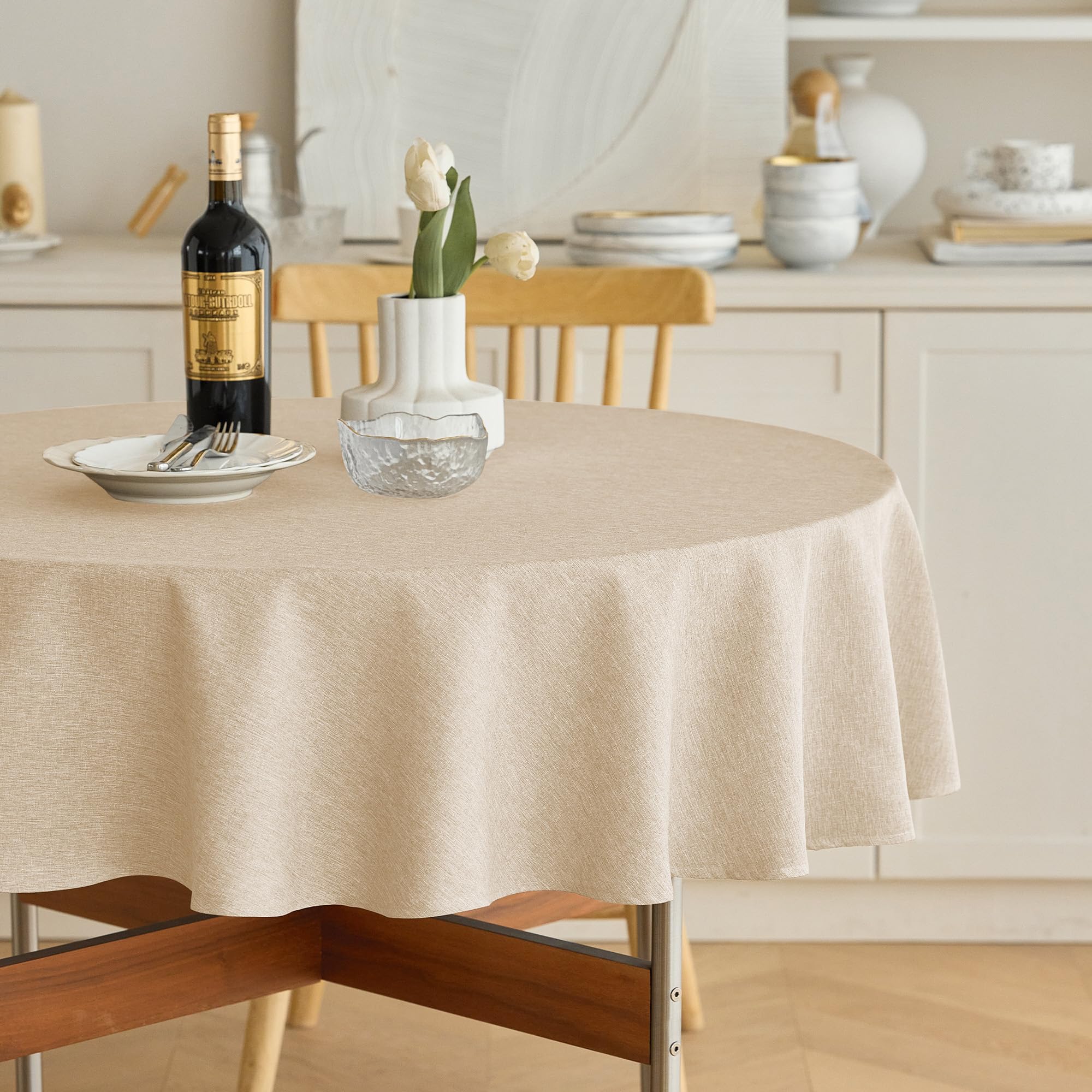 Mantel redondo impermeable Decorelia, ideal para proteger mesas durante cenas.