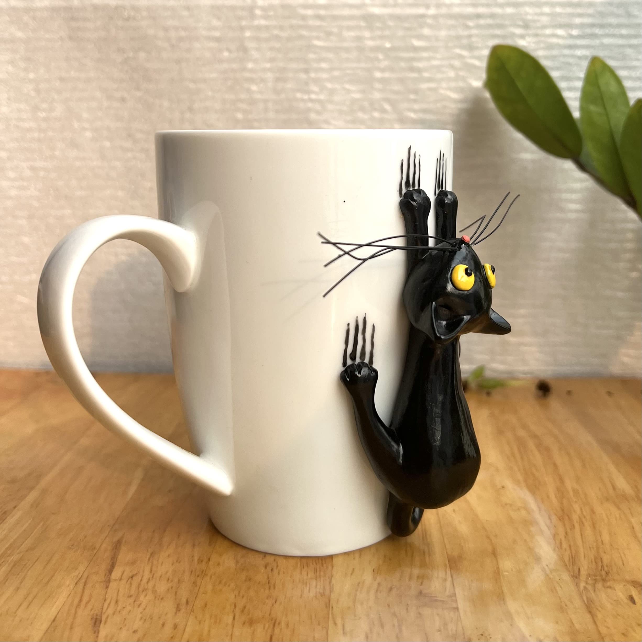 DongNaiWin taza gato negro 3D, vista lateral, asa en forma de cola para un agarre cómodo.