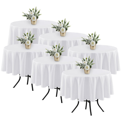 Manteles blancos redondos Fitable de 70 pulgadas, listado en empaque.