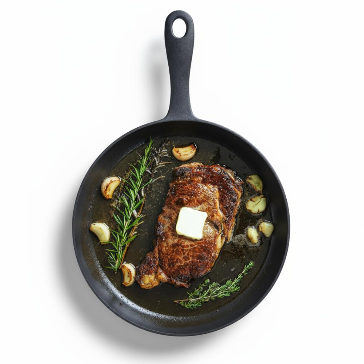 Sartén Flambo de hierro fundido 12" con superficie lisa ideal para dorar y sellar carnes.