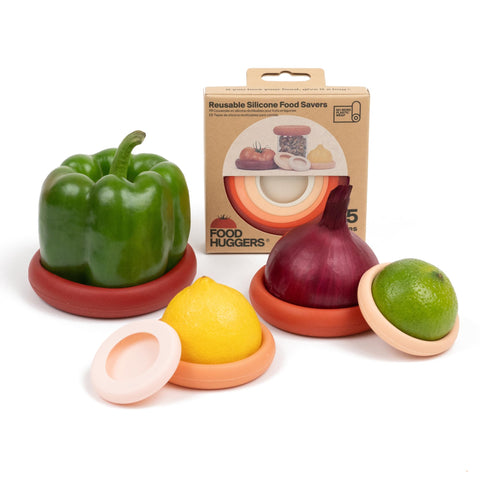 Food Huggers muestra el diseño de abrazadera de silicona para mitades de frutas, sellado seguro.