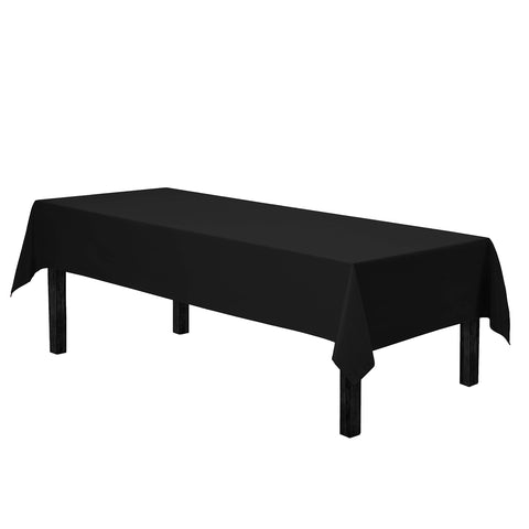 Mantel Gee Di Moda rectangular negro en mesa, perfecta para cenas elegantes.