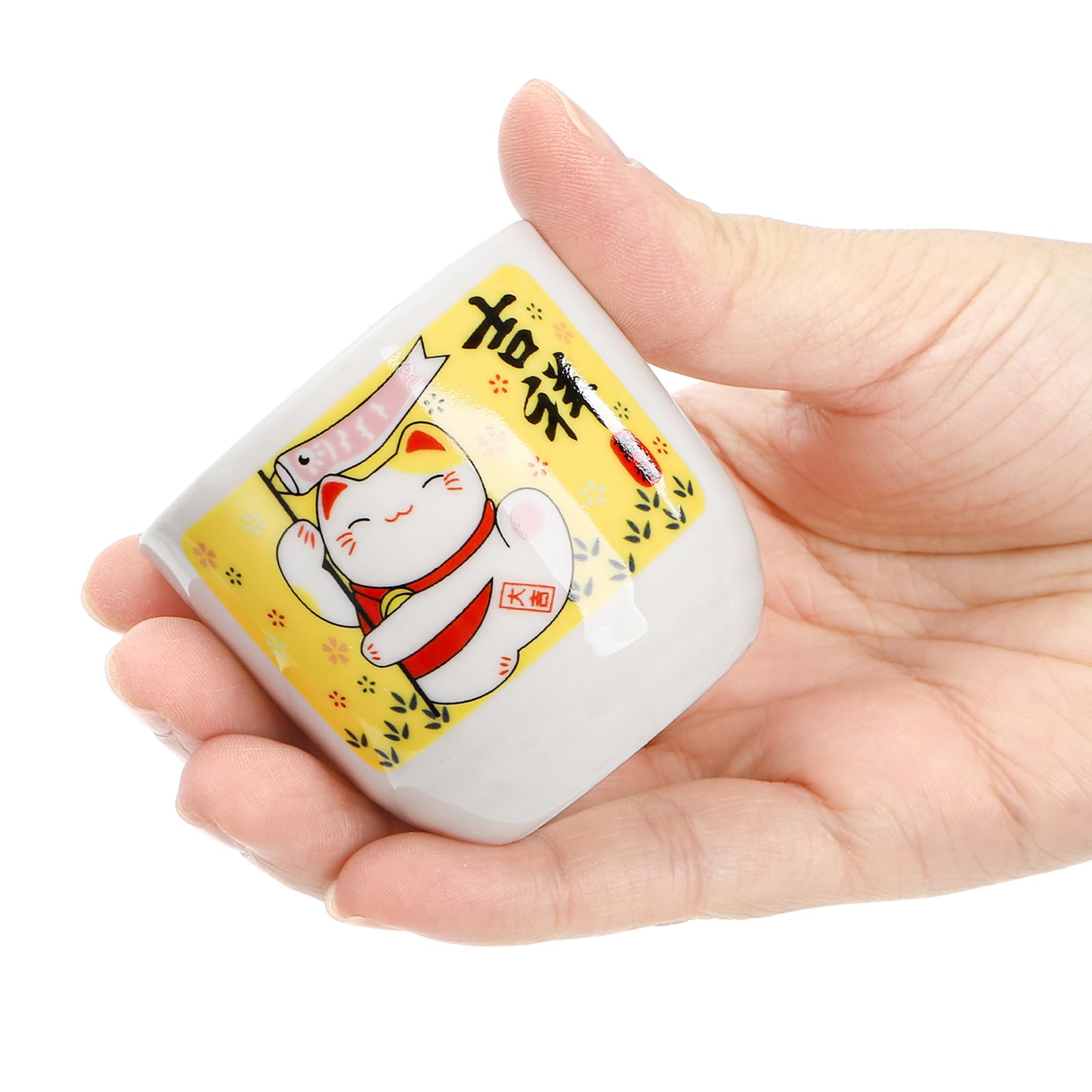 Detalle del dibujo Maneki Neko en la botella de Goaste.