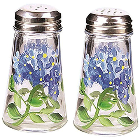 Grant Howard saleros azules con hortensias pintadas, para una mesa elegante y práctica.