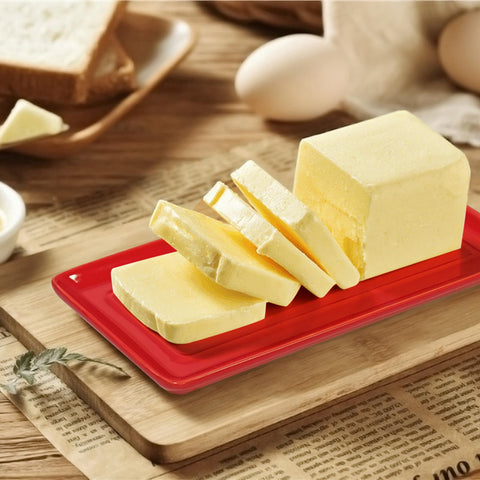 Mantequera Gute con tapa roja, empaque elegante para regalo.