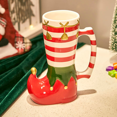 Taza Gute elfo-calcetín-caramelo: ideal para cacao cremoso y momentos festivos.