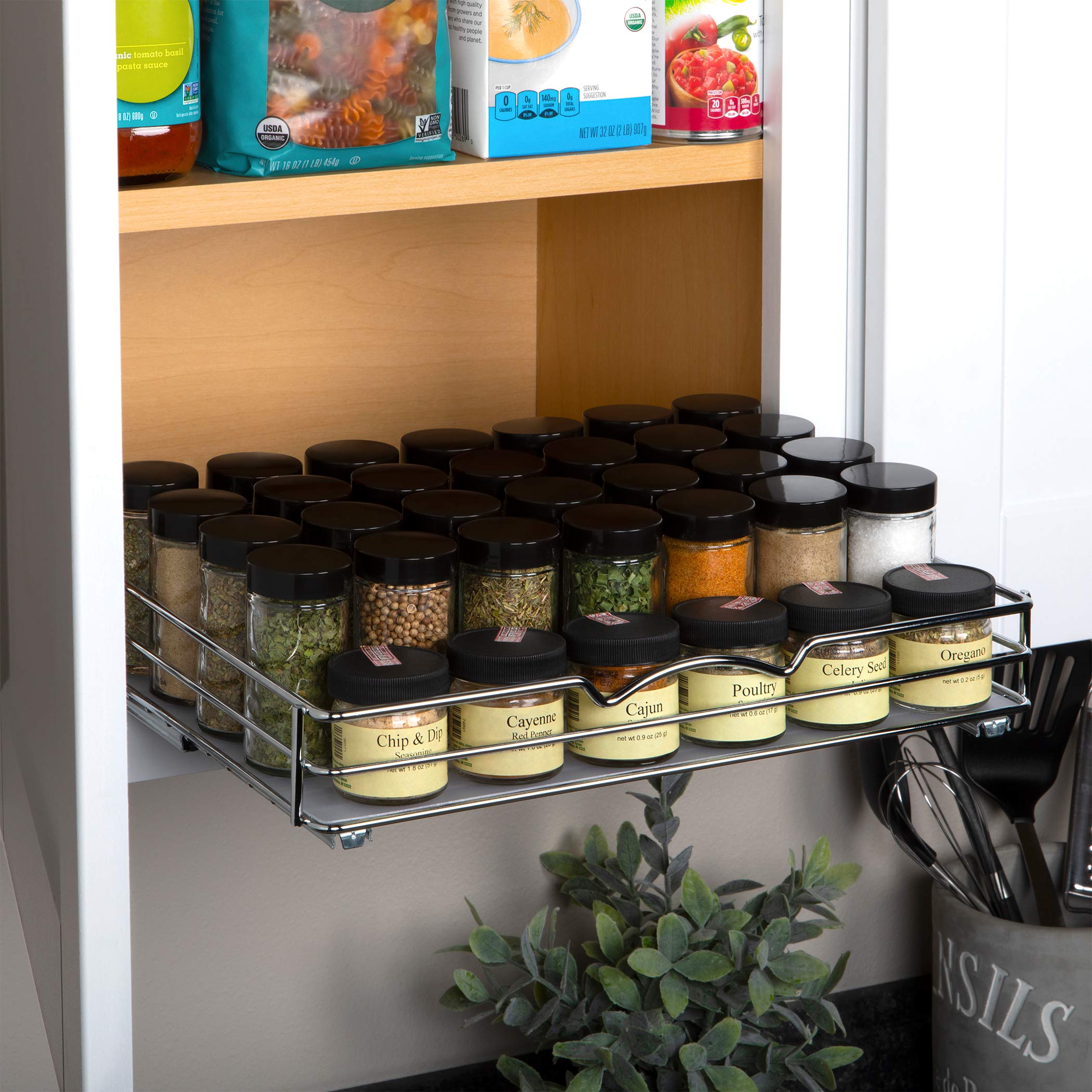 Riel cromado HOLDN STORAGE ideal para frascos de distintos tamaños.