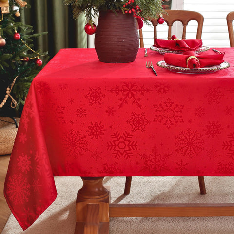 Mantel Honellaty rojo jacquard con copos de nieve para fiestas.