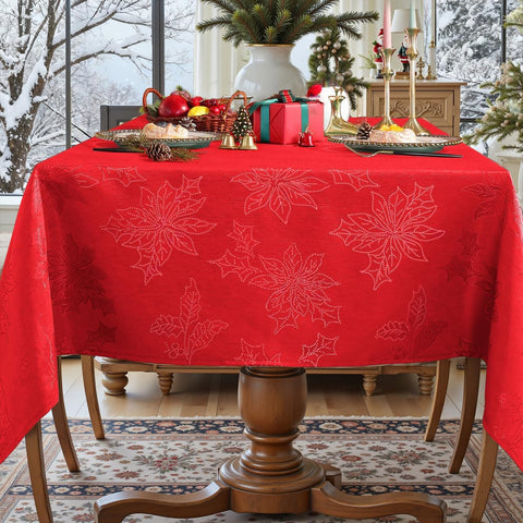 Honellaty mantel con patrón de acebo y poinsettia embellece mesas.