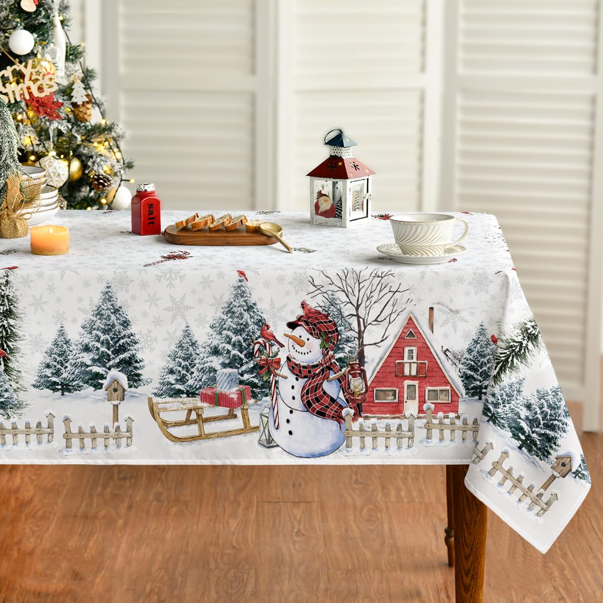Mantel Horaldaily con nieve y muñecos para cenas festivas.
