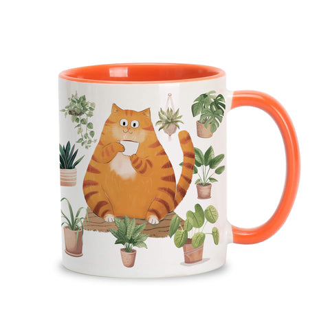 Taza Hyturtle con gato naranja y plantas, ideal para tu ritual de café diario.