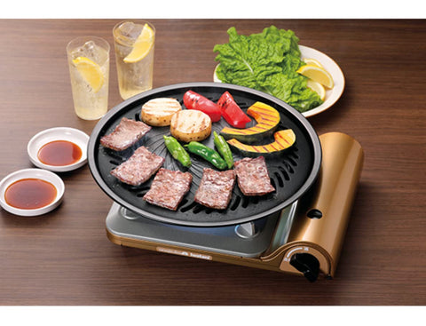 Iwatani plancha grande con drenaje de grasa hacia recipiente de agua para limpieza