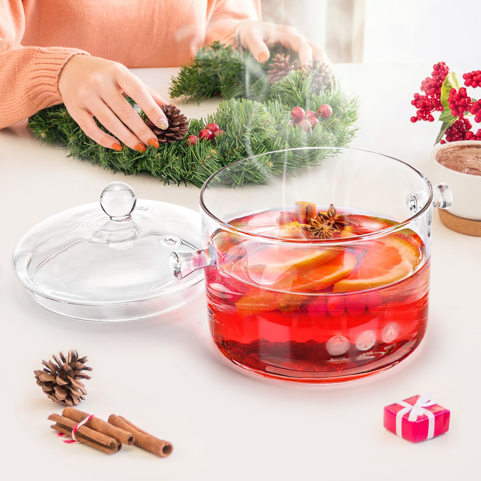 Jucoan olla vidrio 1.5L detalle mango para traslado seguro.