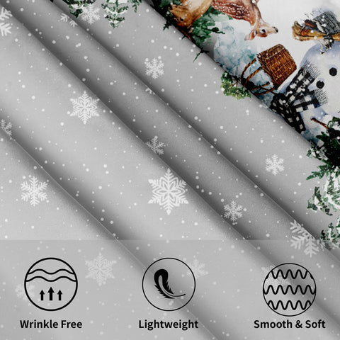 Mantel Kawani con estampado de copos de nieve y muñeco de nieve.