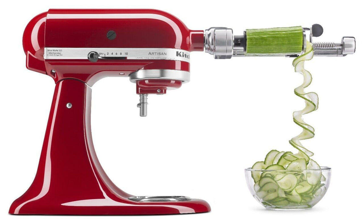 KitchenAid Spiralizer Plus attached to stand mixer making spiralized zucchini ribbons