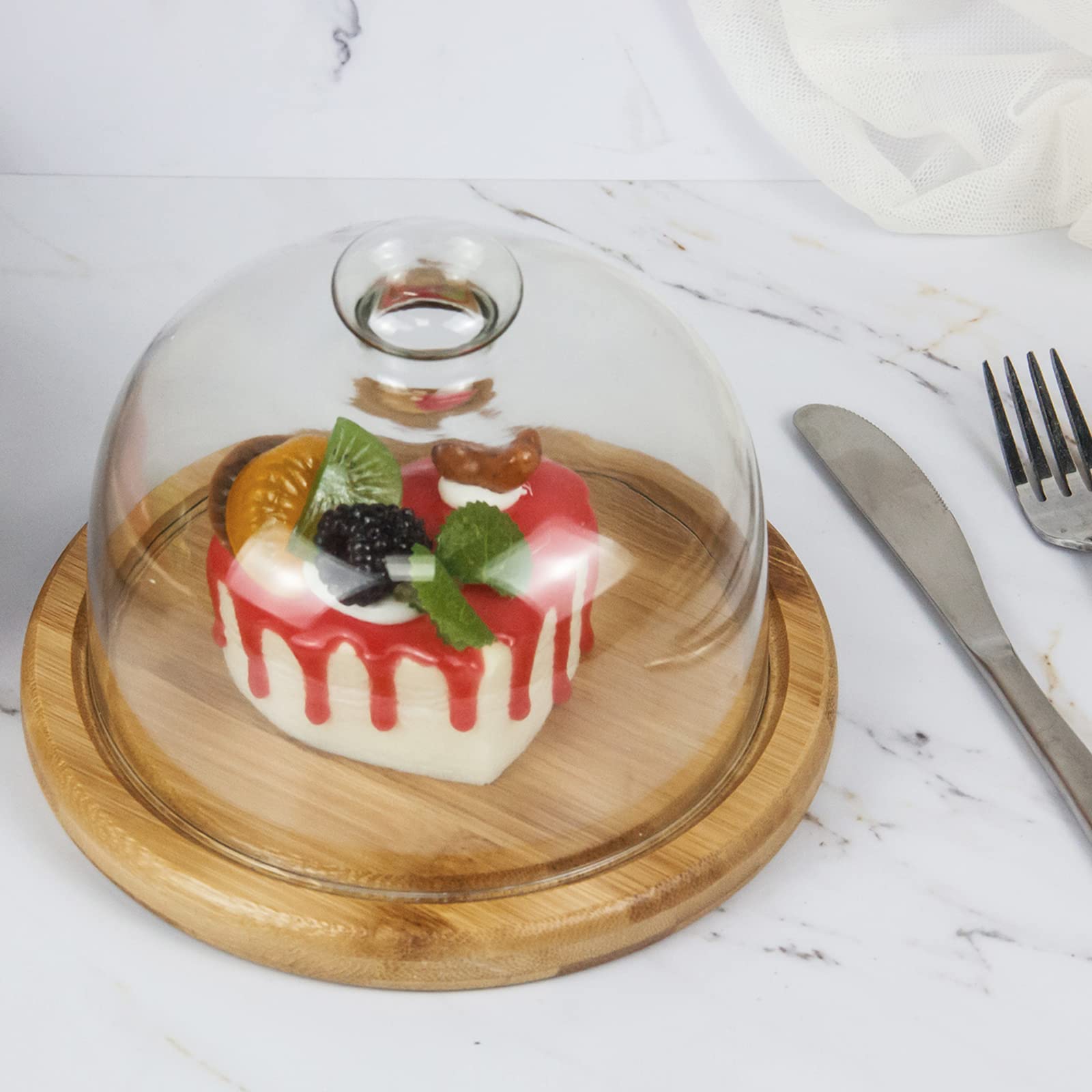 Domo de vidrio KVMORZE para frutas, exhibe frescura en la mesa.