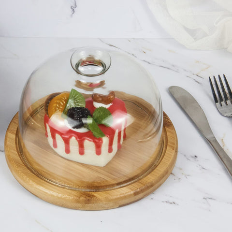 Domo de vidrio KVMORZE para frutas, exhibe frescura en la mesa.