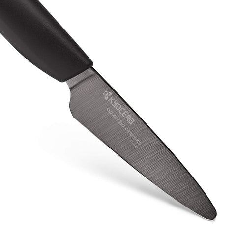 Kyocera cuchillo cerámico 3 pulgadas rebanando frutas y verduras con precisión.