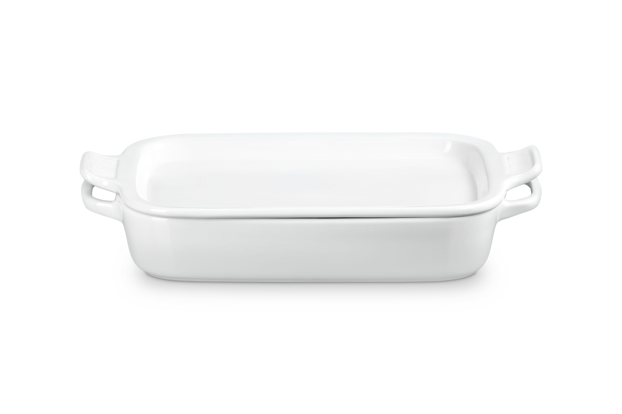 Le Creuset bandeja rectangular con tapa mostrando distribución uniforme del calor ideal para hornear.