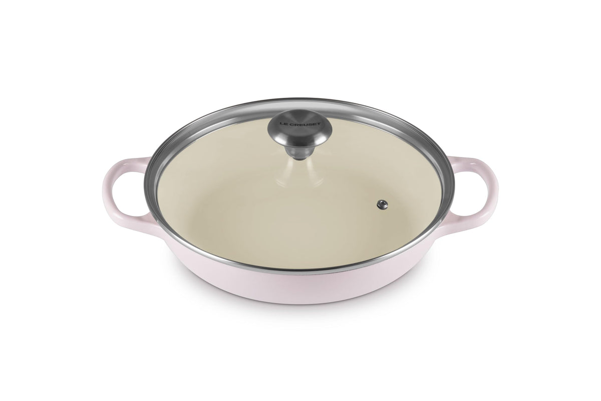 Le Creuset cazuela redonda con tapa de vidrio para cocción uniforme y control visual.