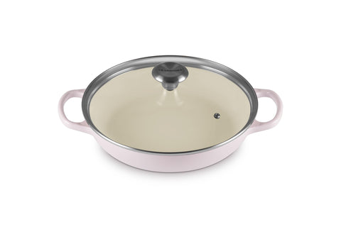 Le Creuset cazuela redonda con tapa de vidrio para cocción uniforme y control visual.