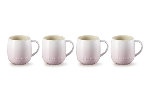 Conjunto de 4 tazas rosa concha Le Creuset sobre mesa, ideal para desayunos.