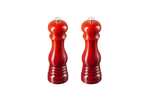 Molinillos cerámicos Le Creuset con mecanismo fino para una molienda uniforme de sal y pimienta.