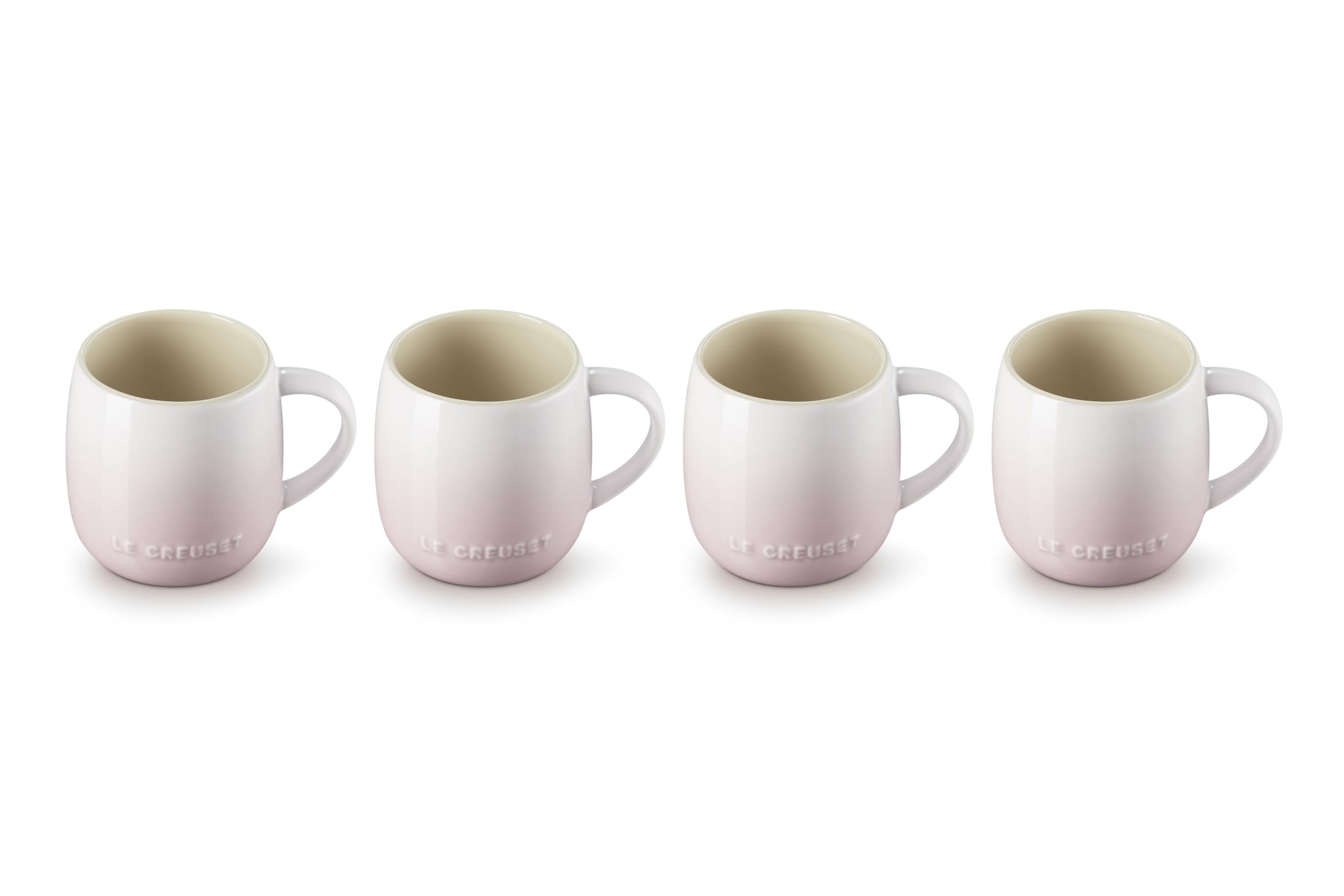 Le Creuset tazas rosa concha primer plano, ideal para café diario.