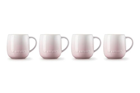 Tazas rosa concha apiladas Le Creuset, ahorro de espacio.