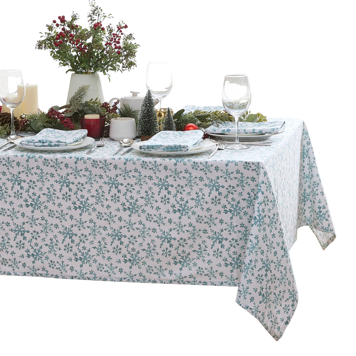 Mantel Lintex con copos de nieve azules sobre blanco, ideal para cenas festivas sin complicaciones