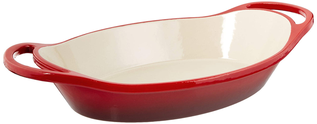 Lodge cazuela oval esmaltada roja, ideal para marinar y servir comidas.
