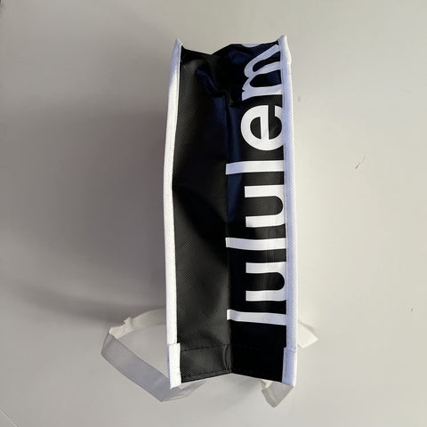 Bolsa tote blanca de lululemon para compras, ideal para organización y reutilizable.