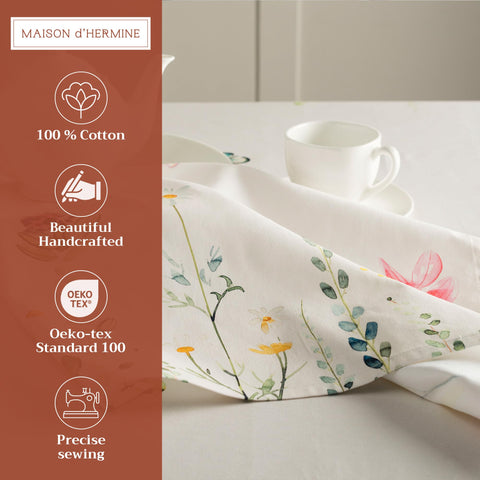 Patrón floral acuarela en servilletas Maison d'Hermine para cenas elegantes.