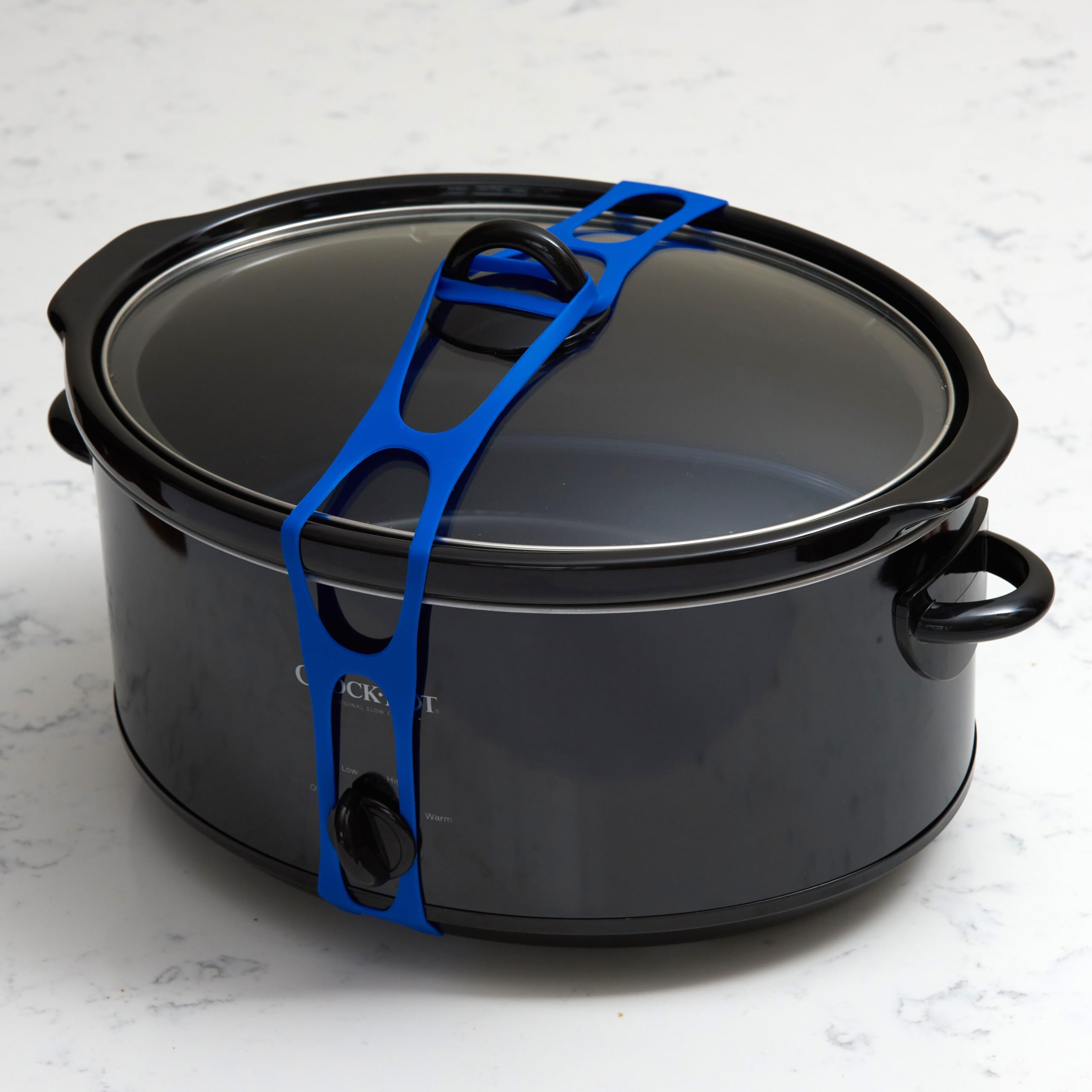 Mella Lid Latch, silicona alimentaria resistente al calor para uso en cocina.