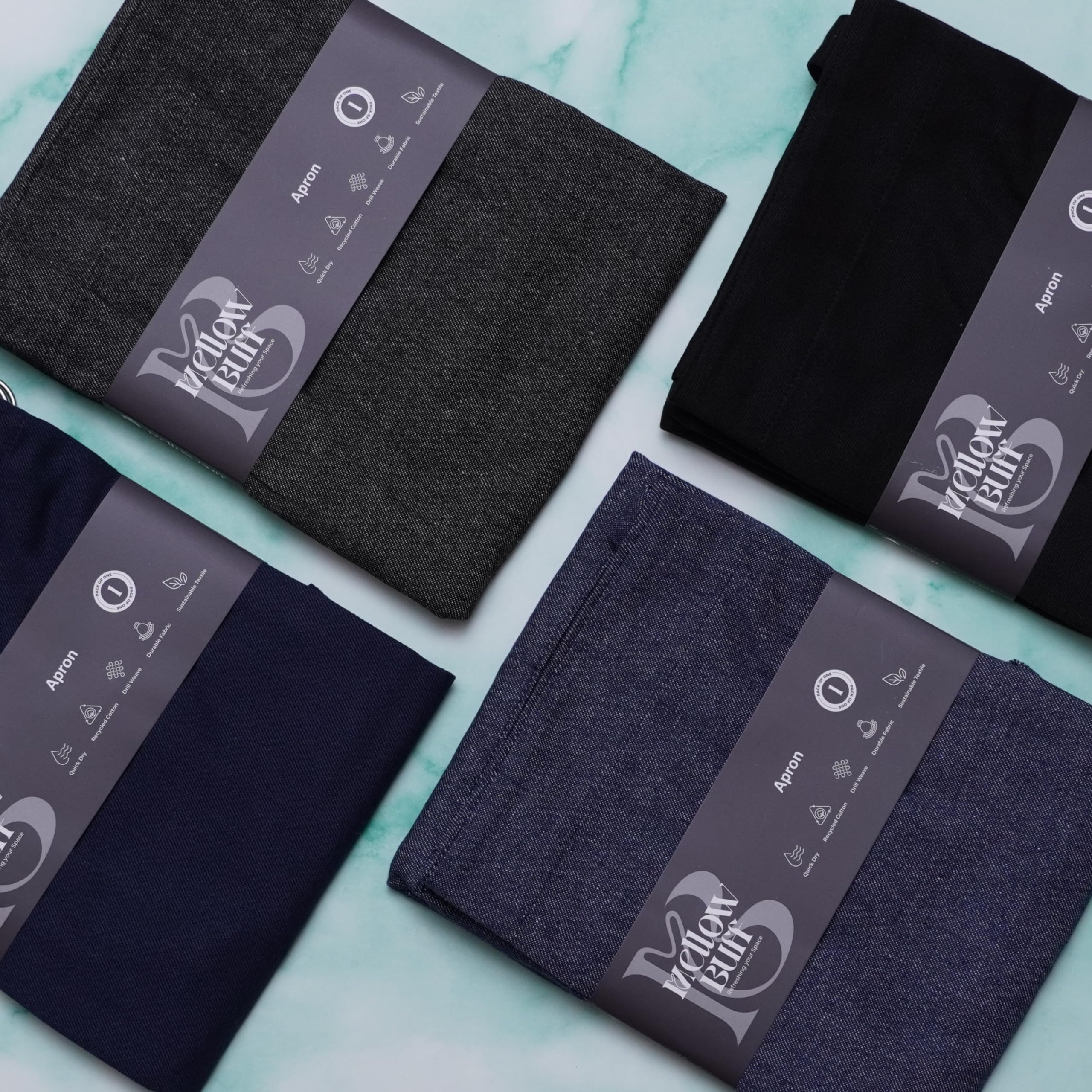 Delantal Mellow Buff en múltiples colores, versátil para cualquier cocina.