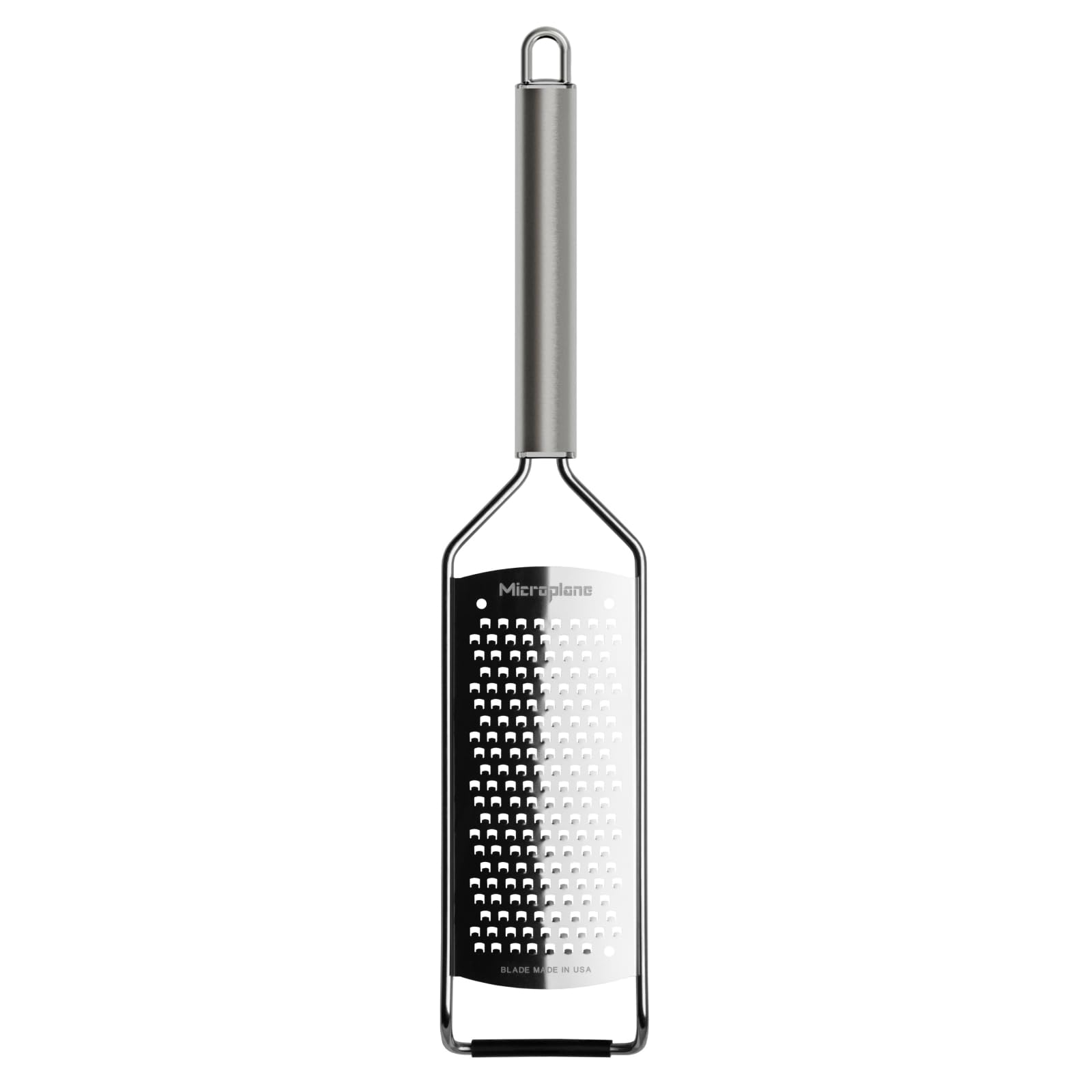 Rallador grueso Microplane para zanahorias, liberando sabor y color en platos frescos