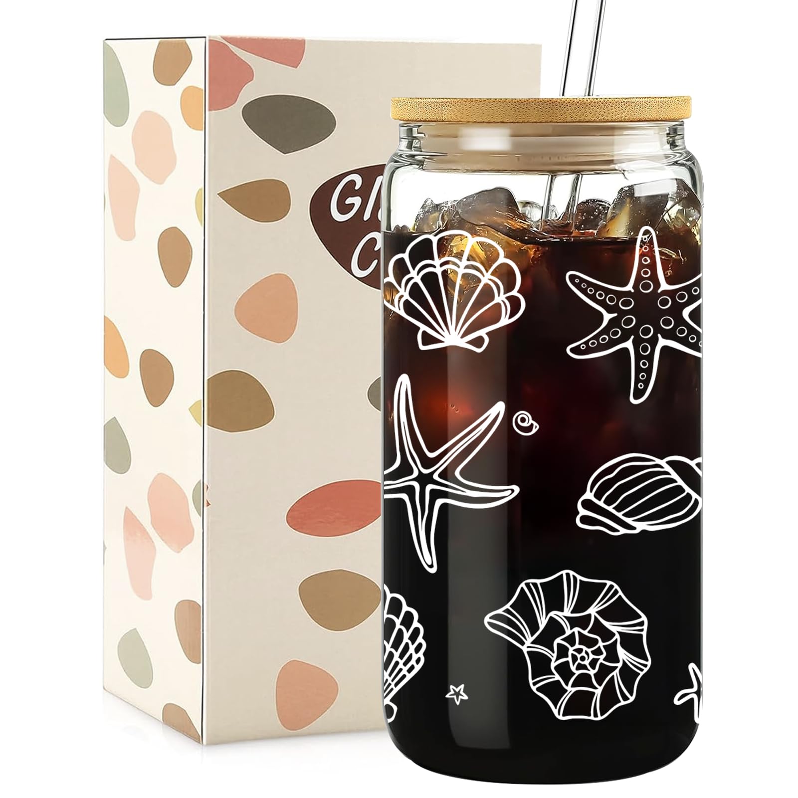 Taza de vidrio Mikopei con tapa y pajilla para bebidas heladas en la playa.