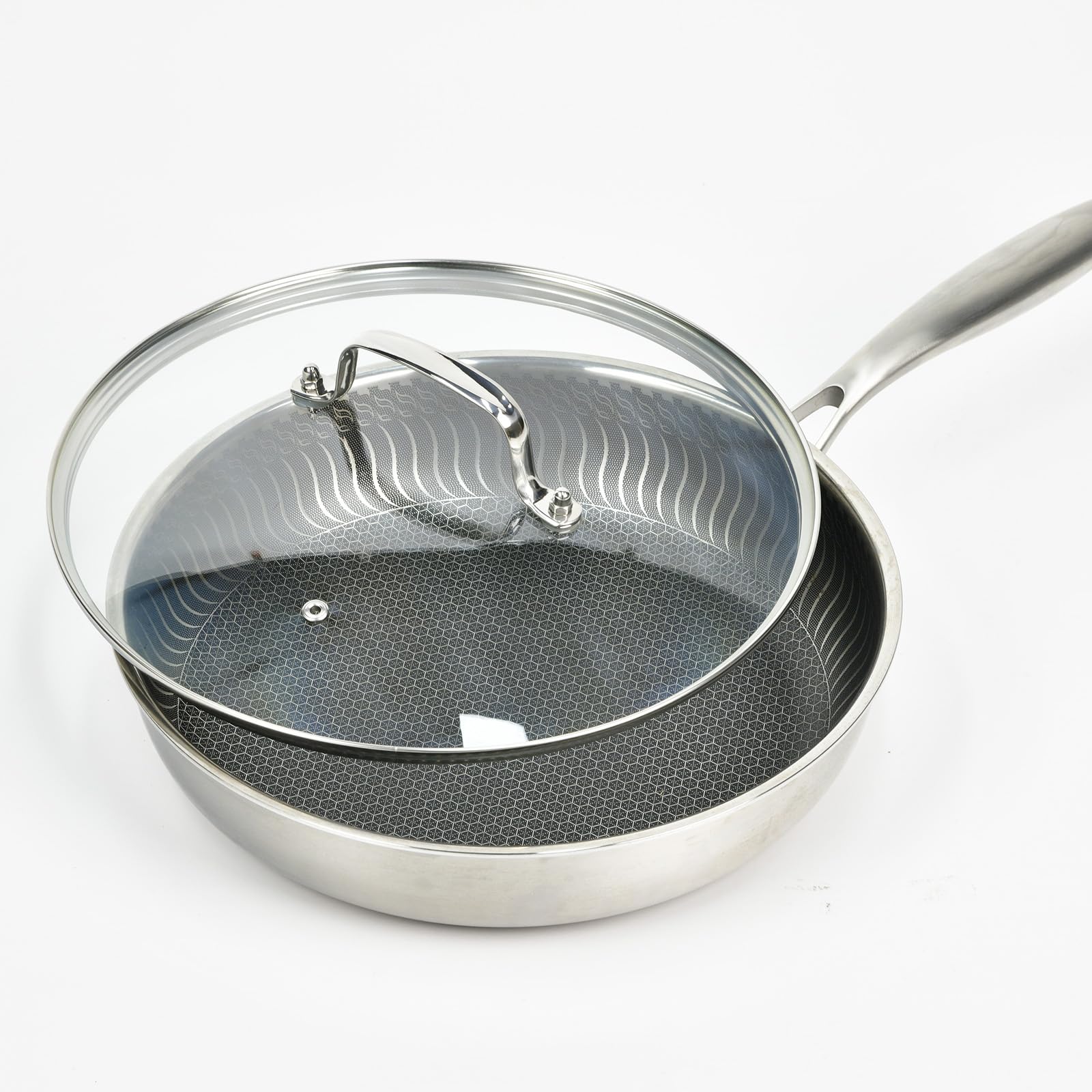 Detalle de MOJIRE tapa vidrio 12 pulgadas con mango ergonómico de acero.
