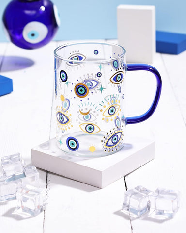 Taza Nefelibata con ojos malvados azules, ideal para empezar el día con café.
