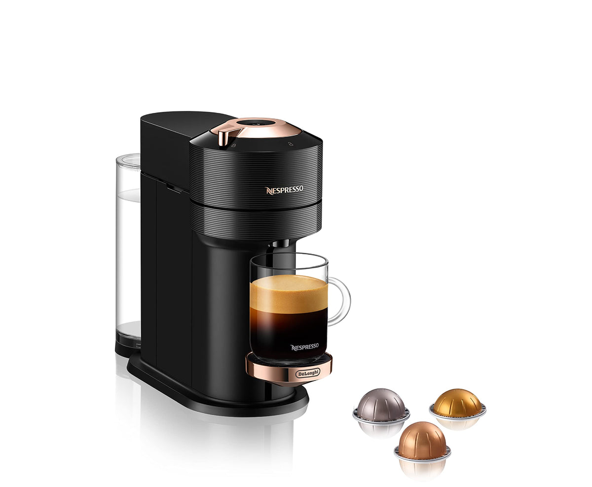 Nespresso Vertuo Next frente en negro con acabado oro rosa, diseño elegante para cocinas modernas.
