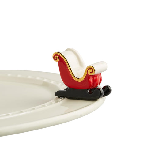 Nora Fleming Sleigh Bells Ring: miniatura del trineo, ideal para decorar mesas festivas.
