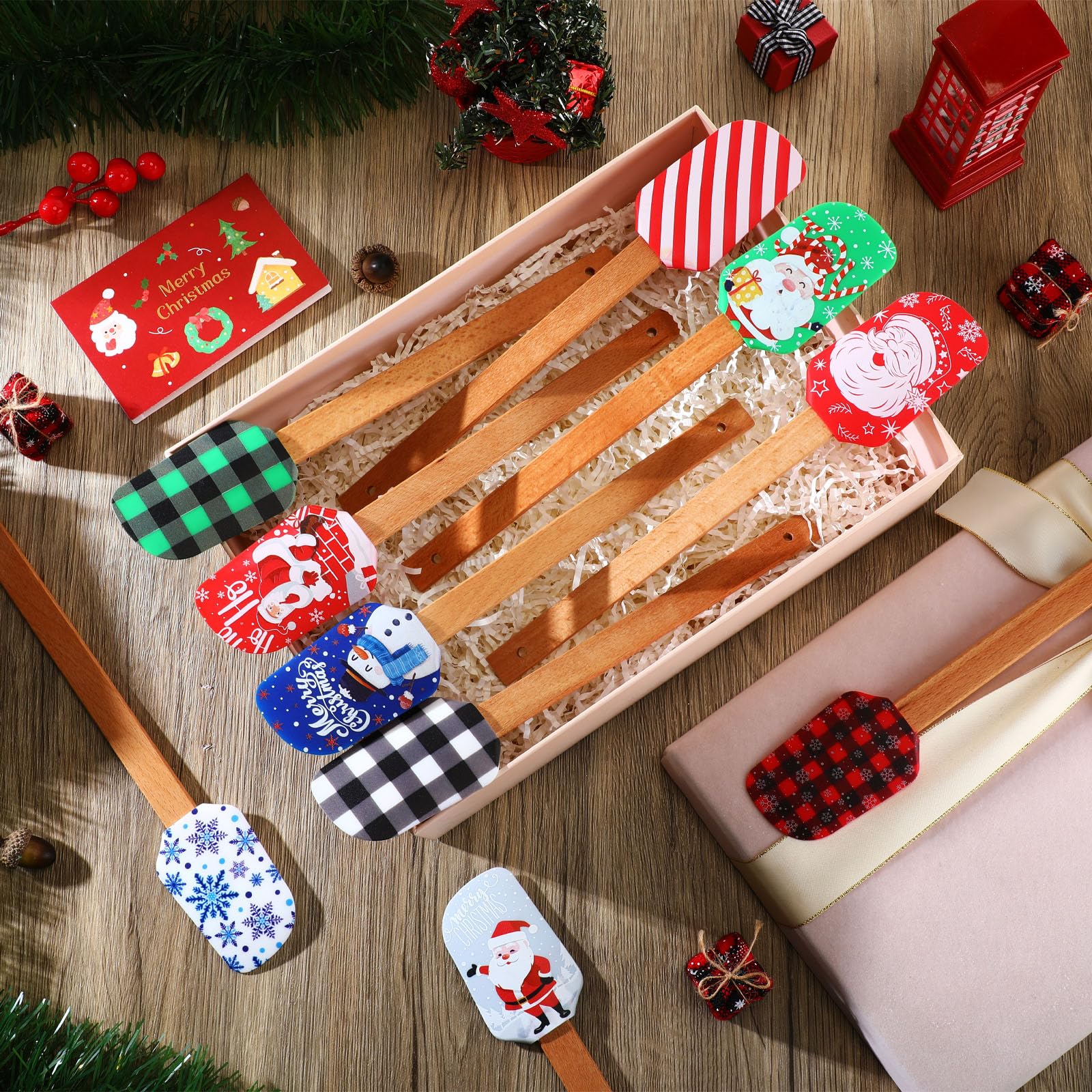 Espátula Nitial con tarjeta navideña incluida, regalo práctico para cocinas.