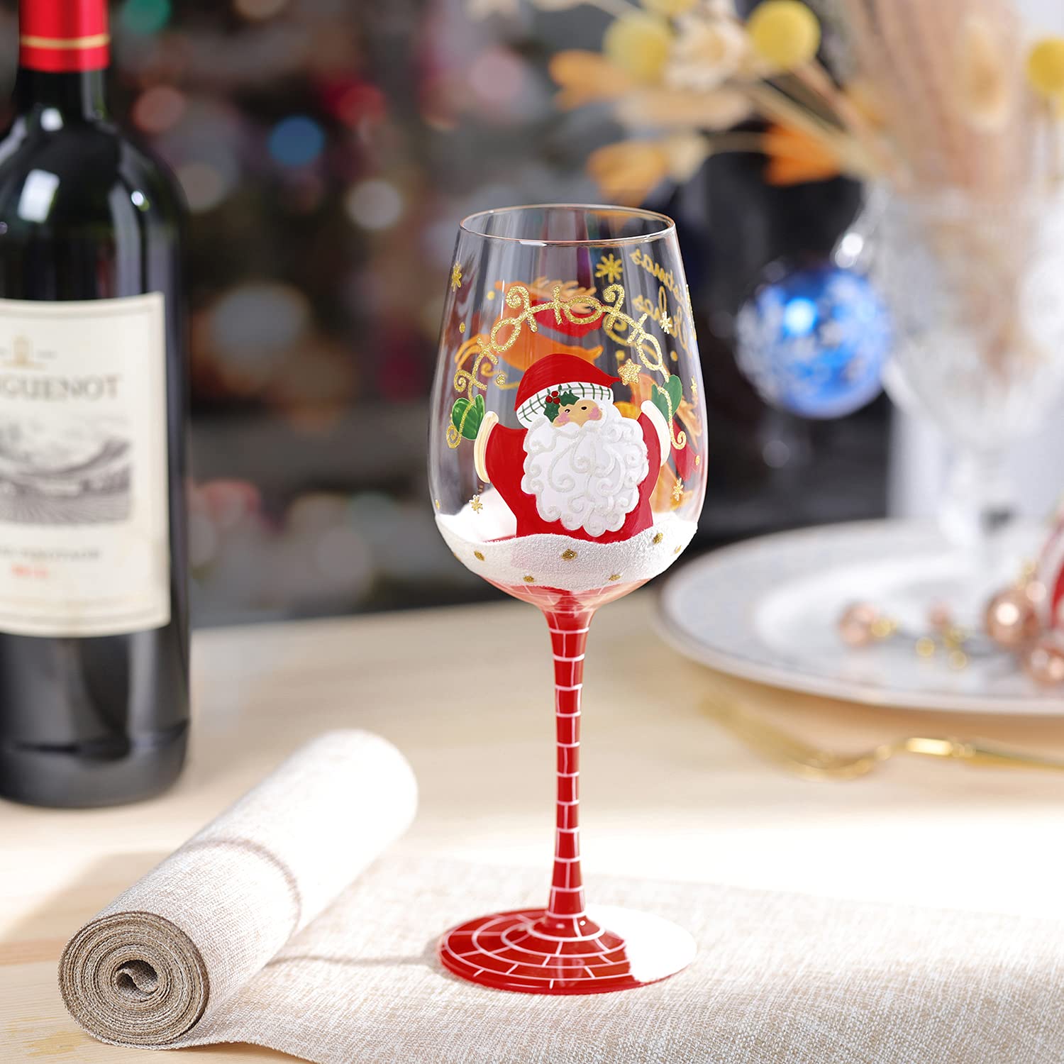 Vaso NymphFable con Papá Noel saliendo de la chimenea, ambiente navideño.