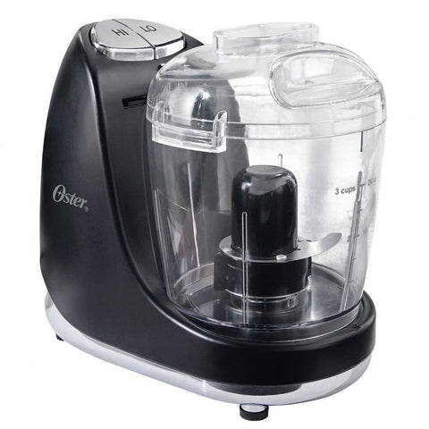 Oster mini picadora 3 tazas con batidora, ideal para trocear verduras rápidamente.