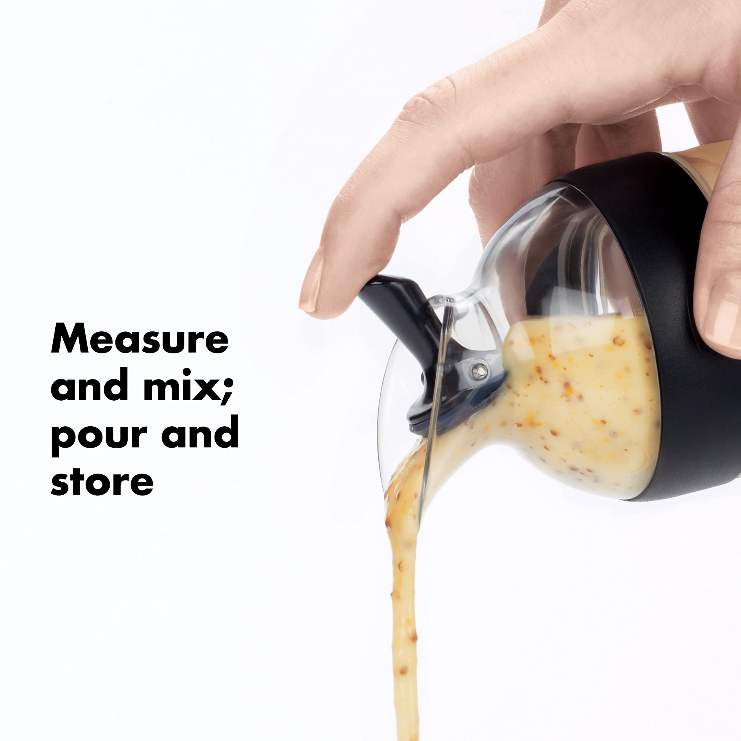 OXO Good Grips Mini agitador, sello hermético, evita derrames al batir.